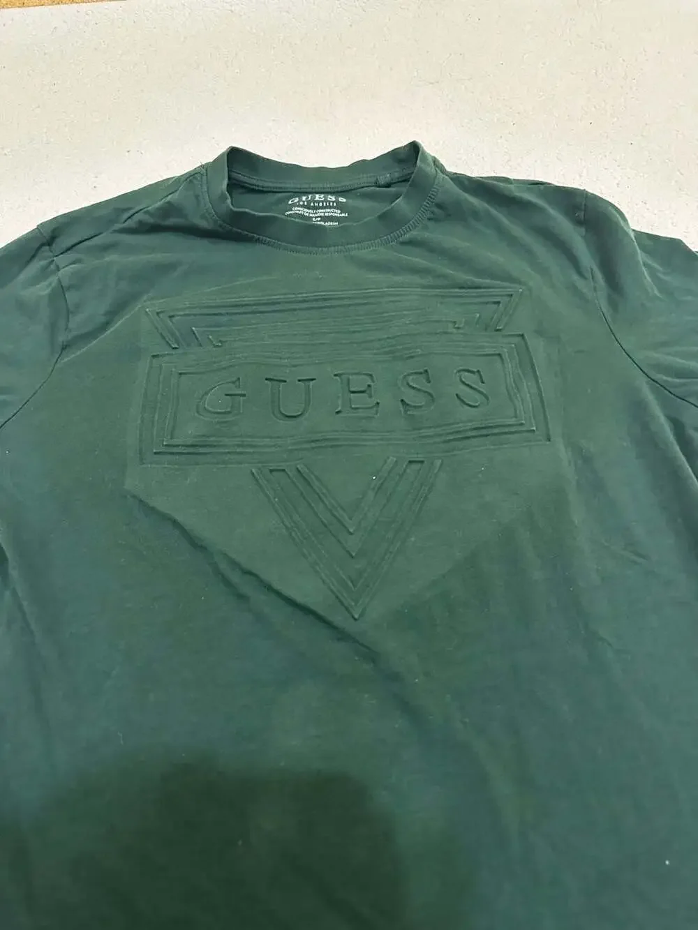 GUESS Men's Eco Short Sleeve Embossed Triangle Logo Tee in Dark Green - Picture 2 of 4